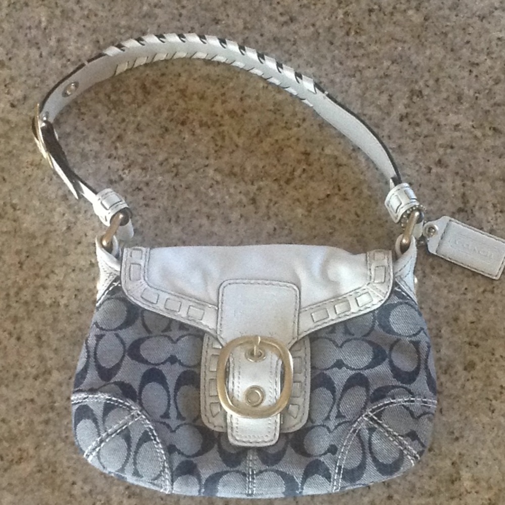 Small blue with white leather Coach purse.